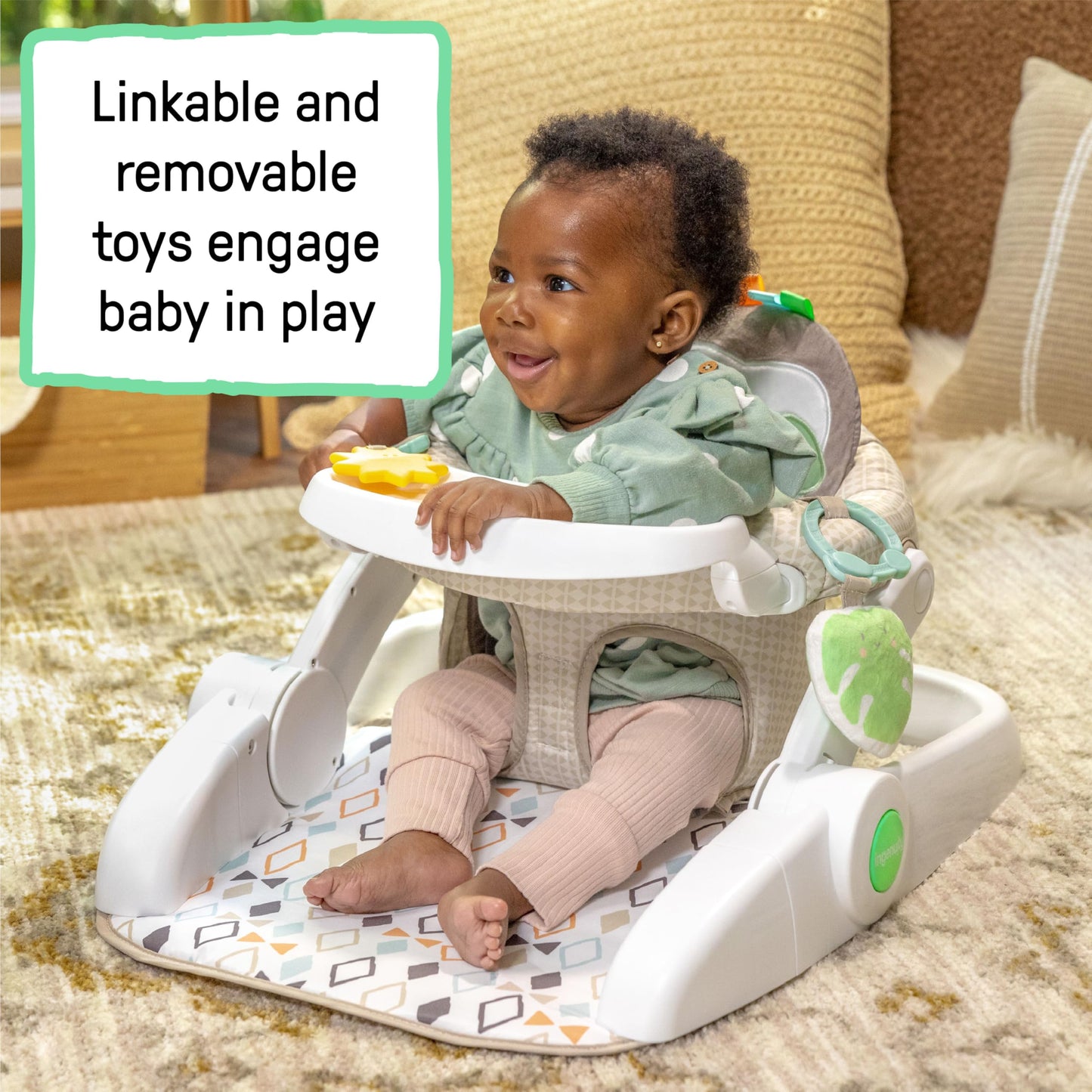 Top down view of Ingenuity baby floor seat tray and toys