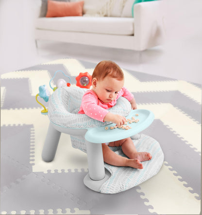 Skip Hop baby floor seat showing rotating tray feature