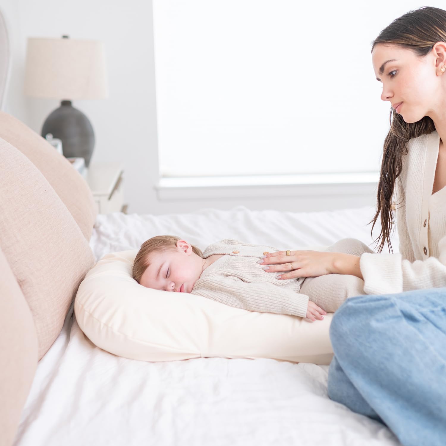 Side profile of baby lounger with cotton slipcover installed