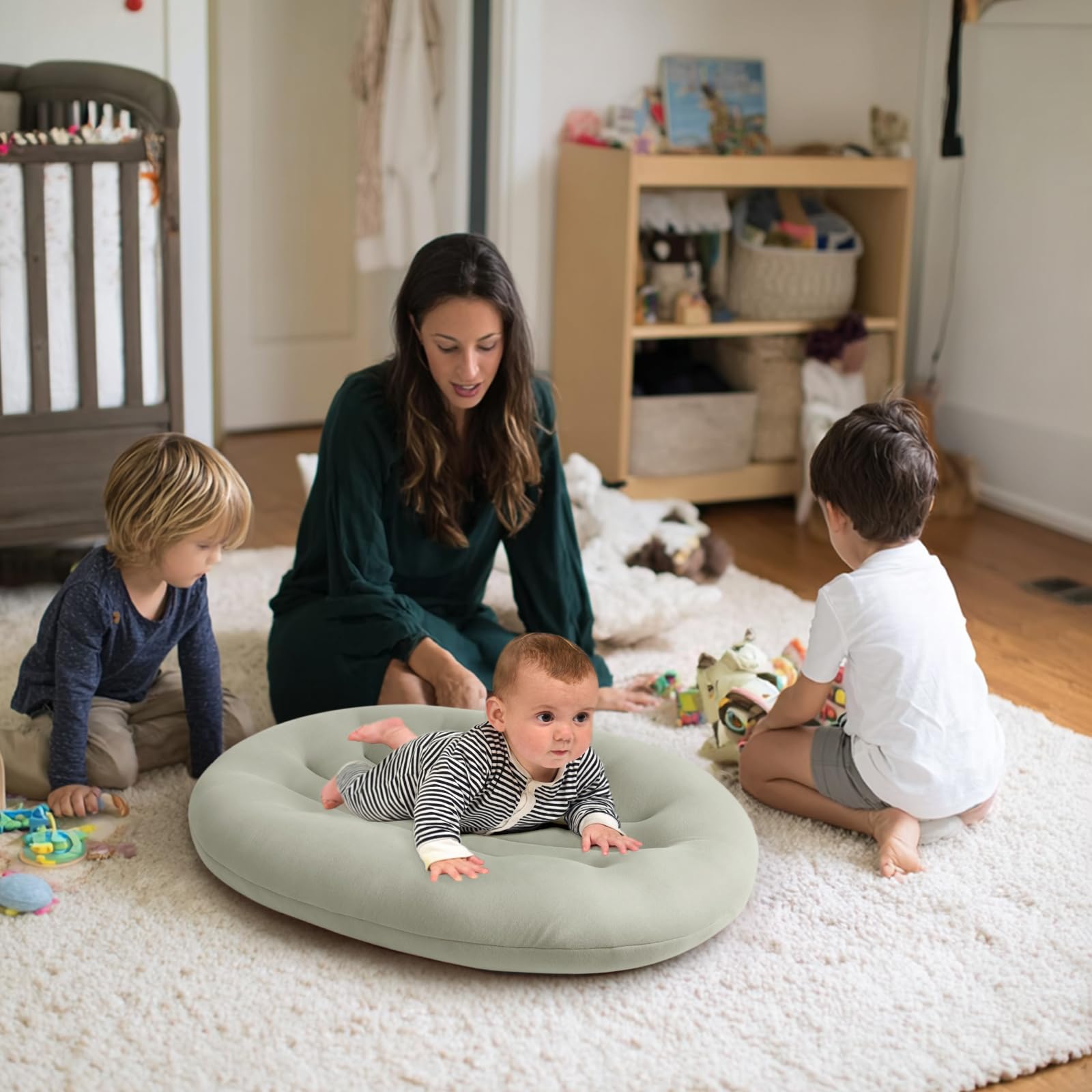 Portable baby lounger being used for supervised play