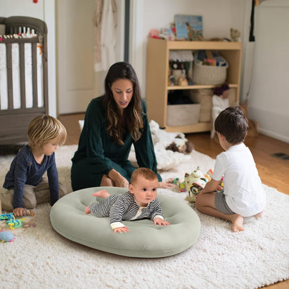Portable baby lounger being used for supervised play