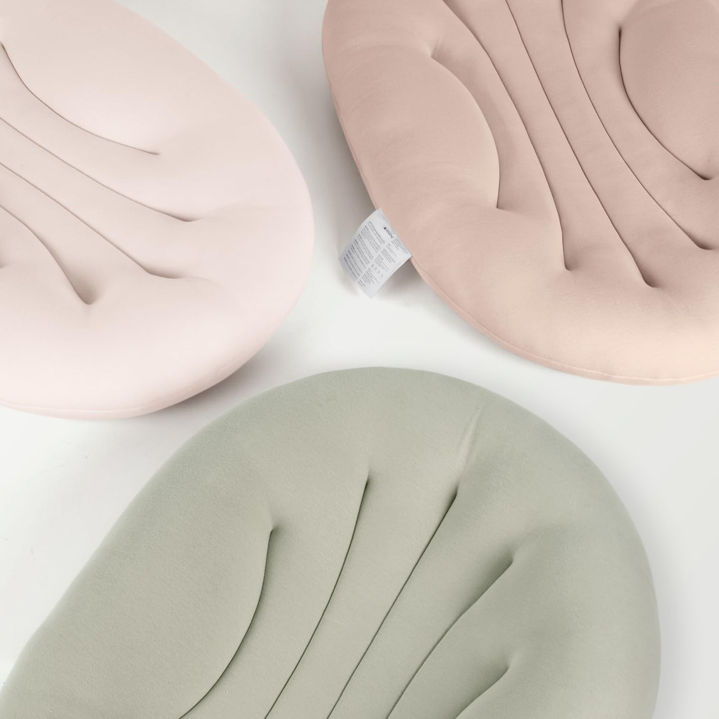 Infant comfortably resting on baby lounger for tummy time