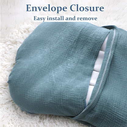 Hooyax muslin cover being placed on a newborn lounger pillow
