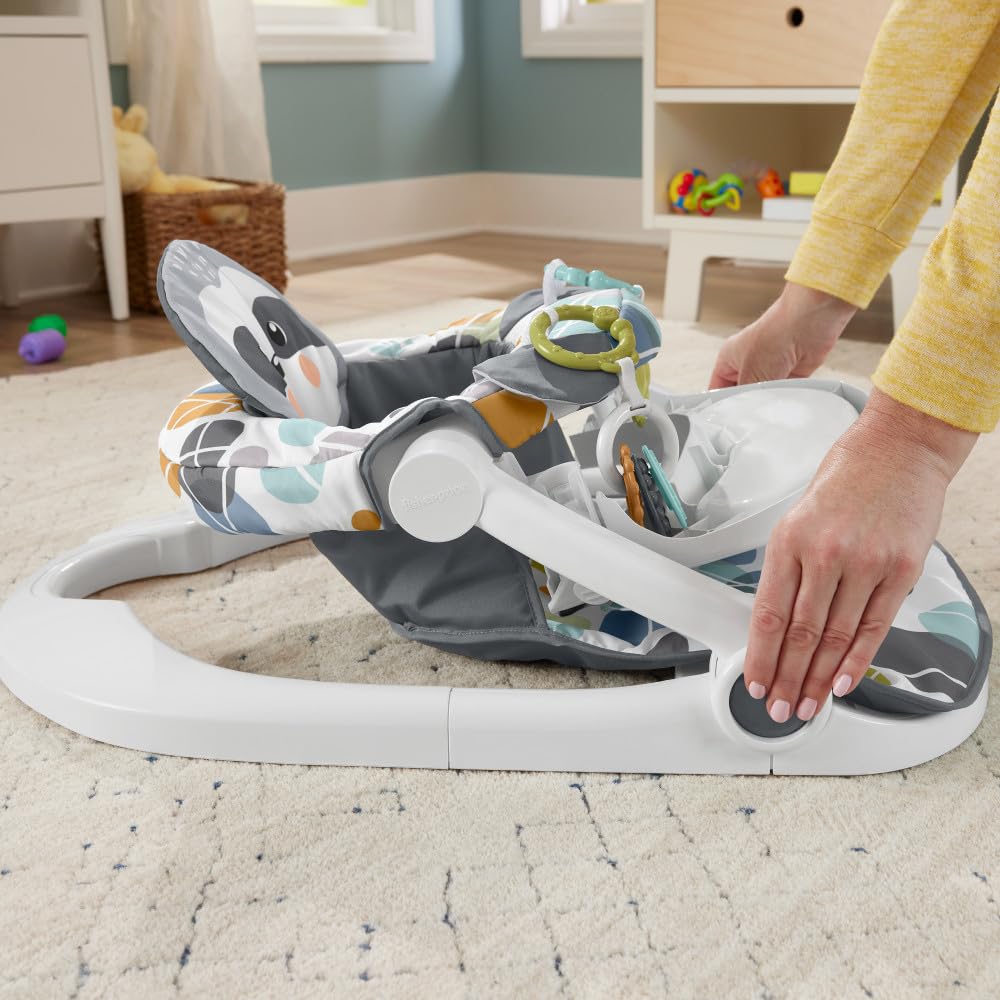 Close up of sloth sensory activity toys on baby seat