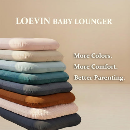Baby resting comfortably in Loevin cotton baby nest