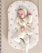 Vintage floral pattern detail on newborn lounger slipcover