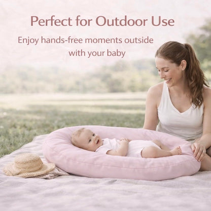 Side view of portable pink baby lounger with carry handle
