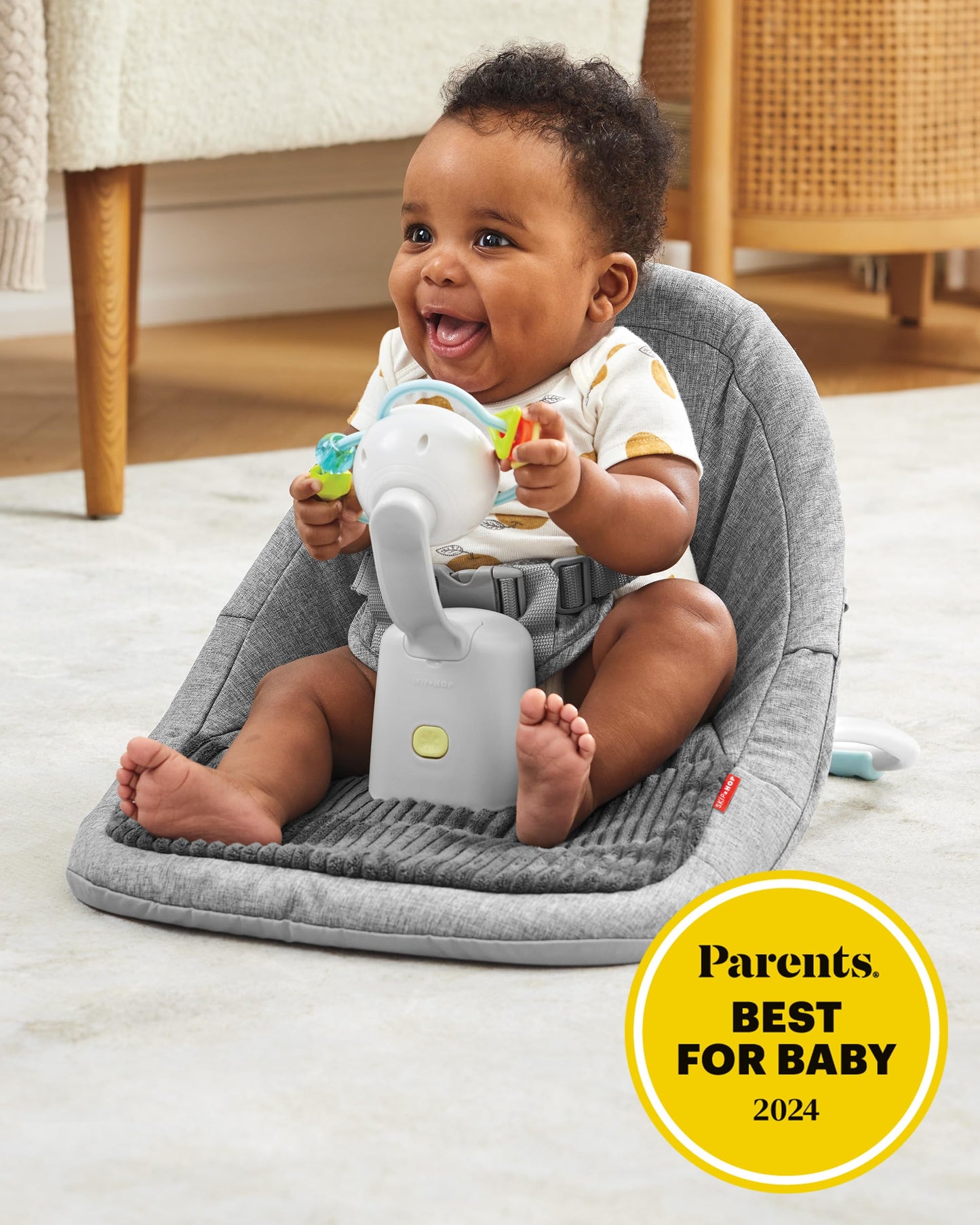 Skip Hop ergonomic activity floor seat showing detachable multisensory toy bar