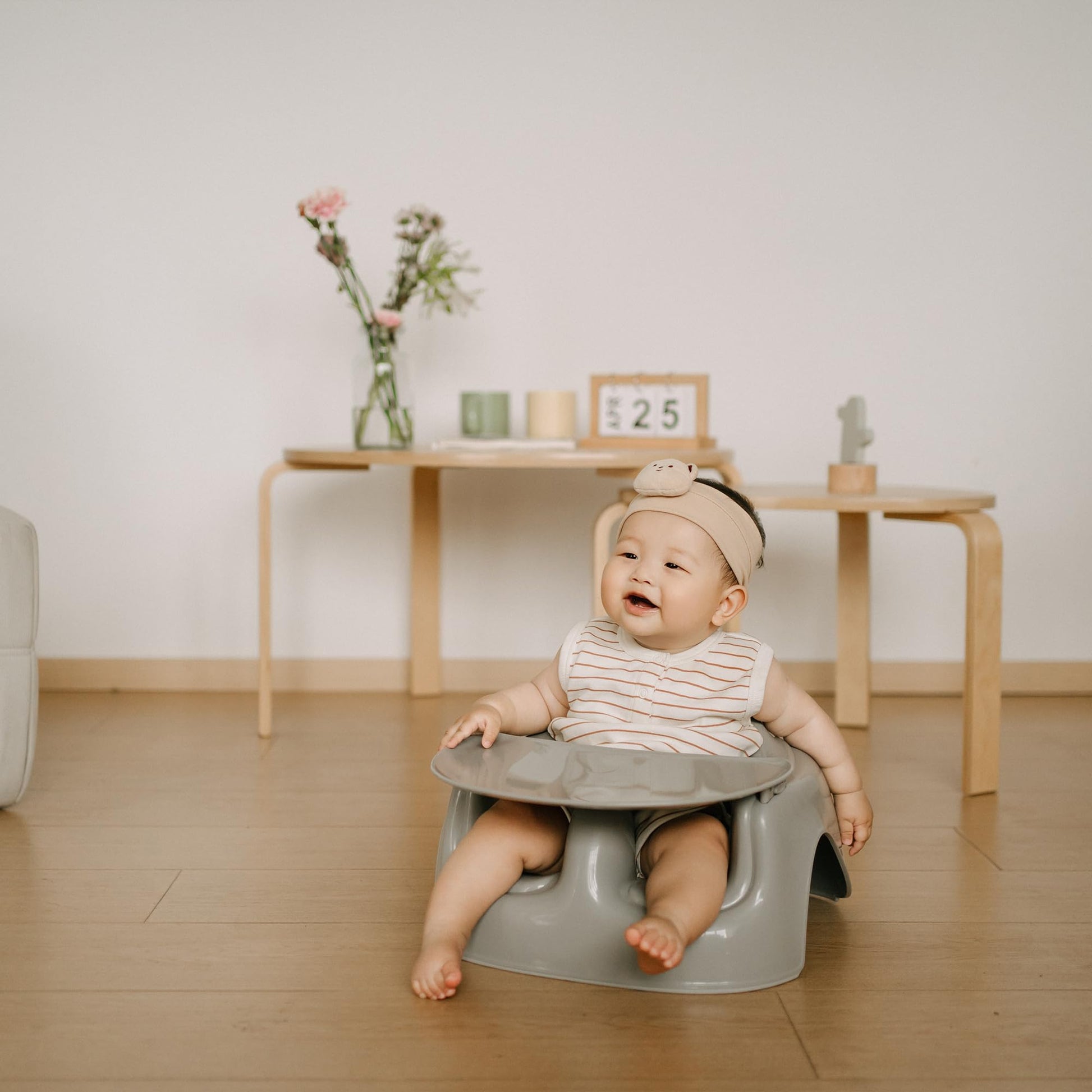 Bumbo infant seat placed on floor for baby playtime