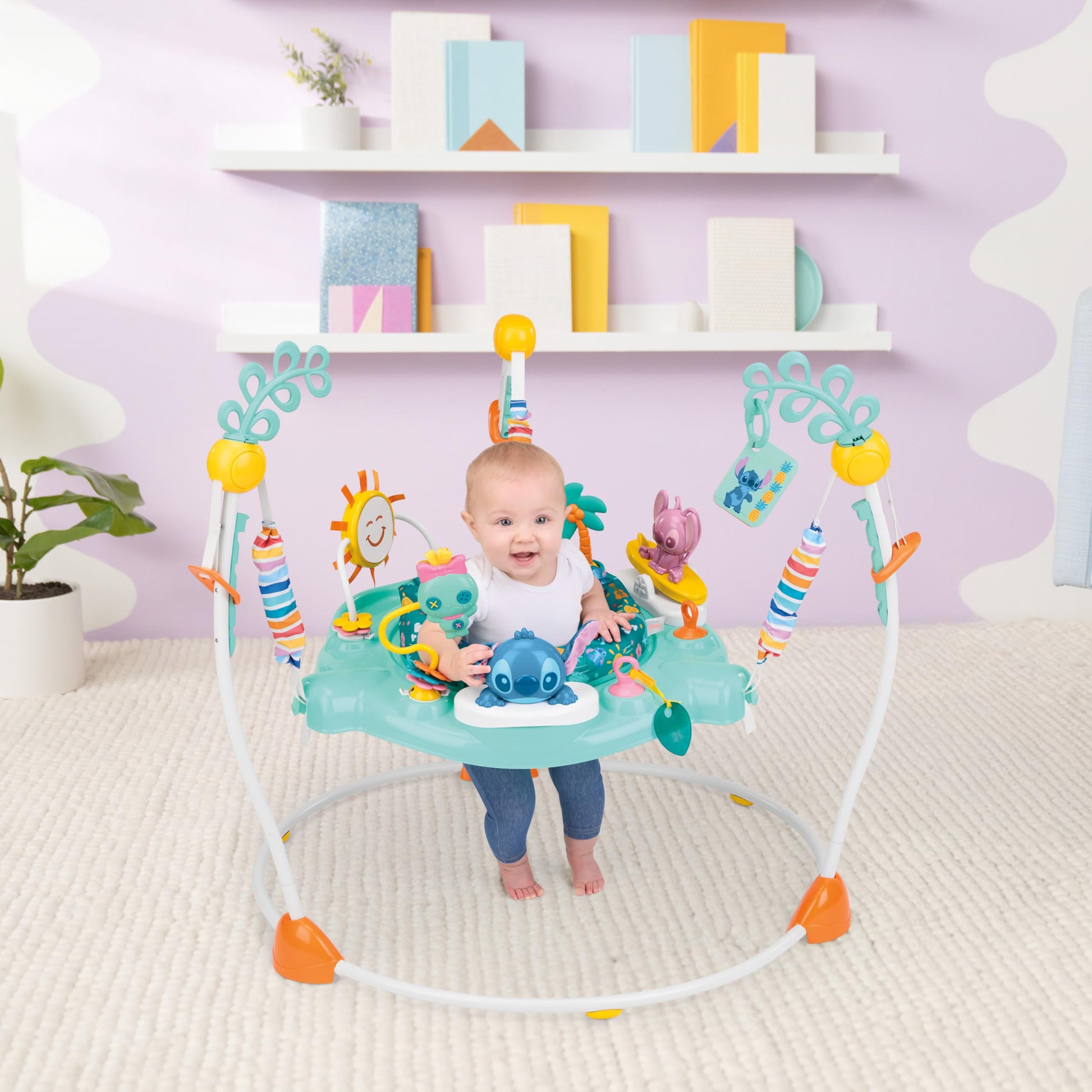 Baby playing in Stitch themed activity center with lights
