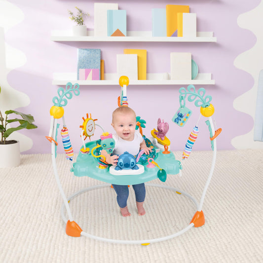 Baby playing in Stitch themed activity center with lights
