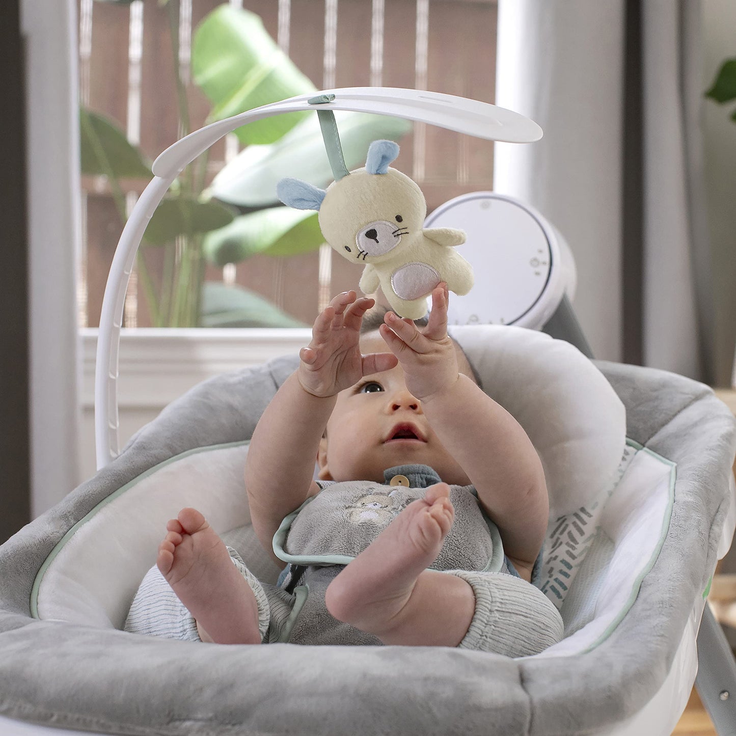 Ingenuity Anyway Sway baby swing in a living room setting