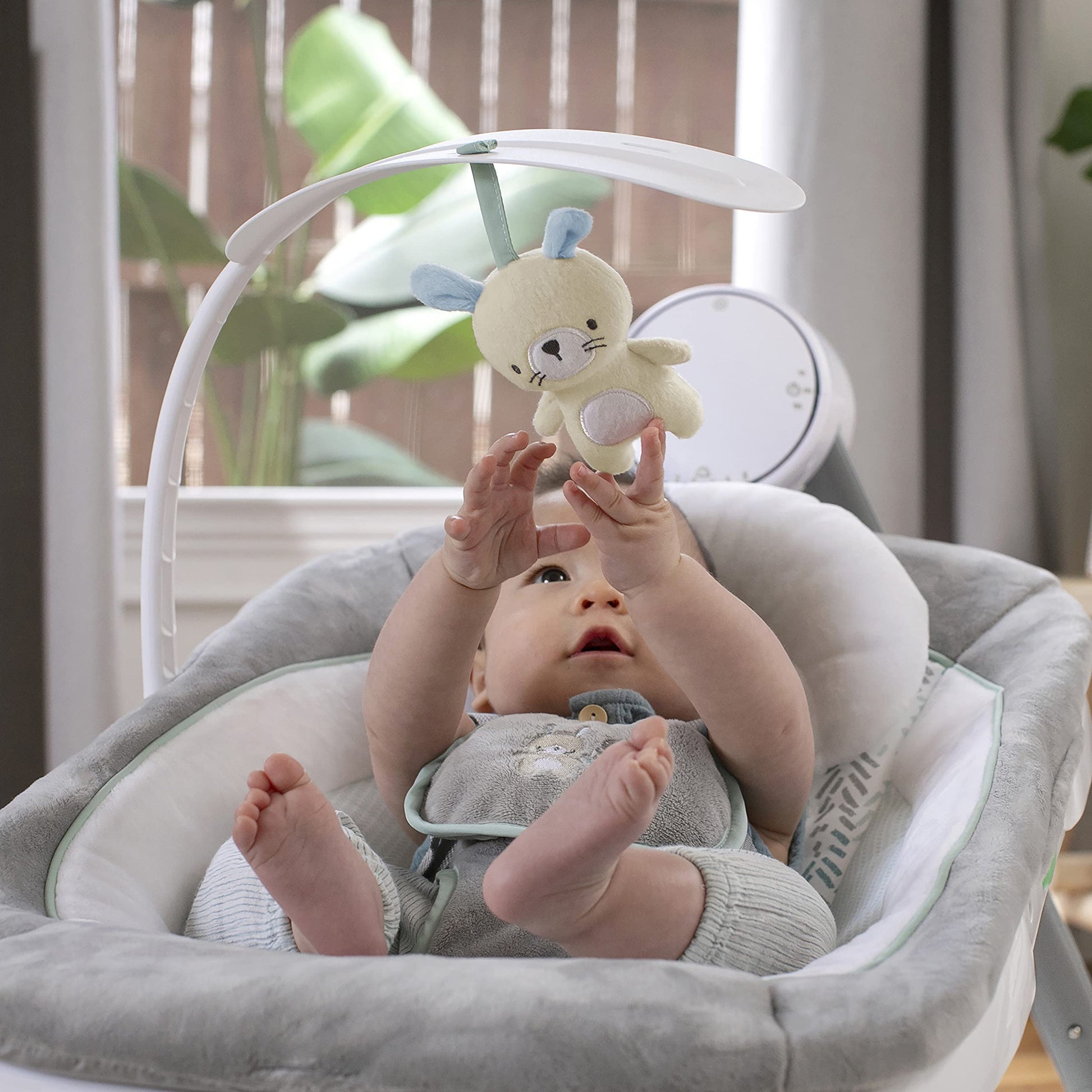 Ingenuity Anyway Sway baby swing in a living room setting