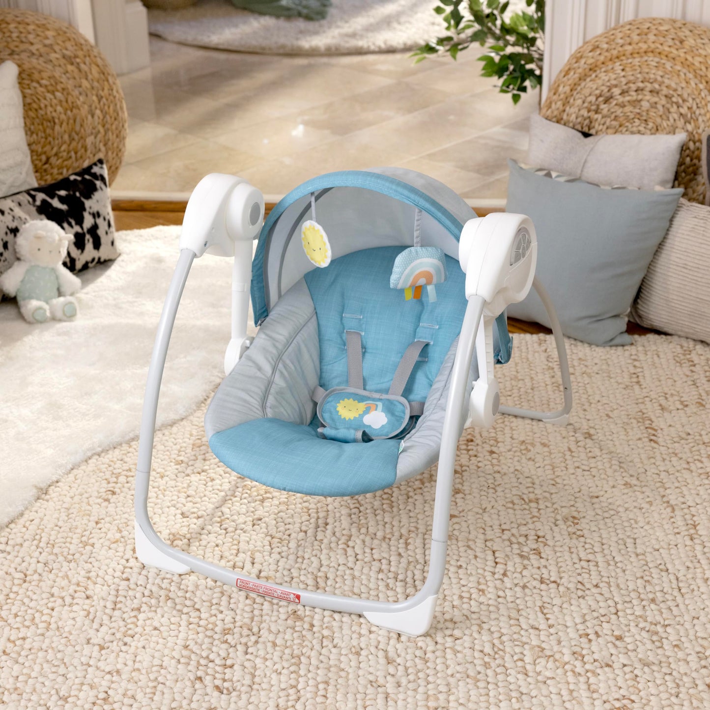 Side profile of Ingenuity Sun Valley baby swing with canopy extended