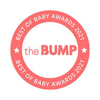 Angle view of the Munchkin electric baby swing set up in a modern room