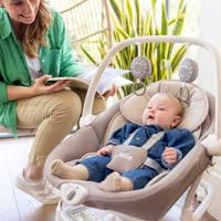 Compact footprint base structure of Joie baby rocker in room setting