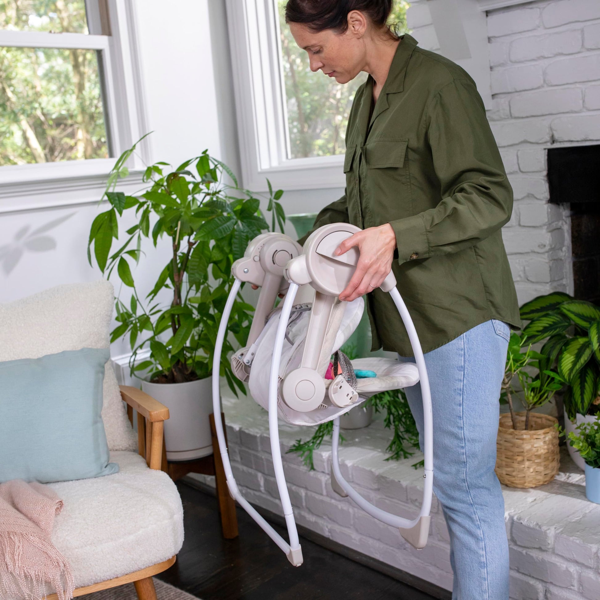 Ingenuity Cozy Kingdom baby swing side profile showing recline