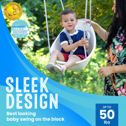 Toddler using the Swurfer Coconut swing outdoors in a backyard setting.