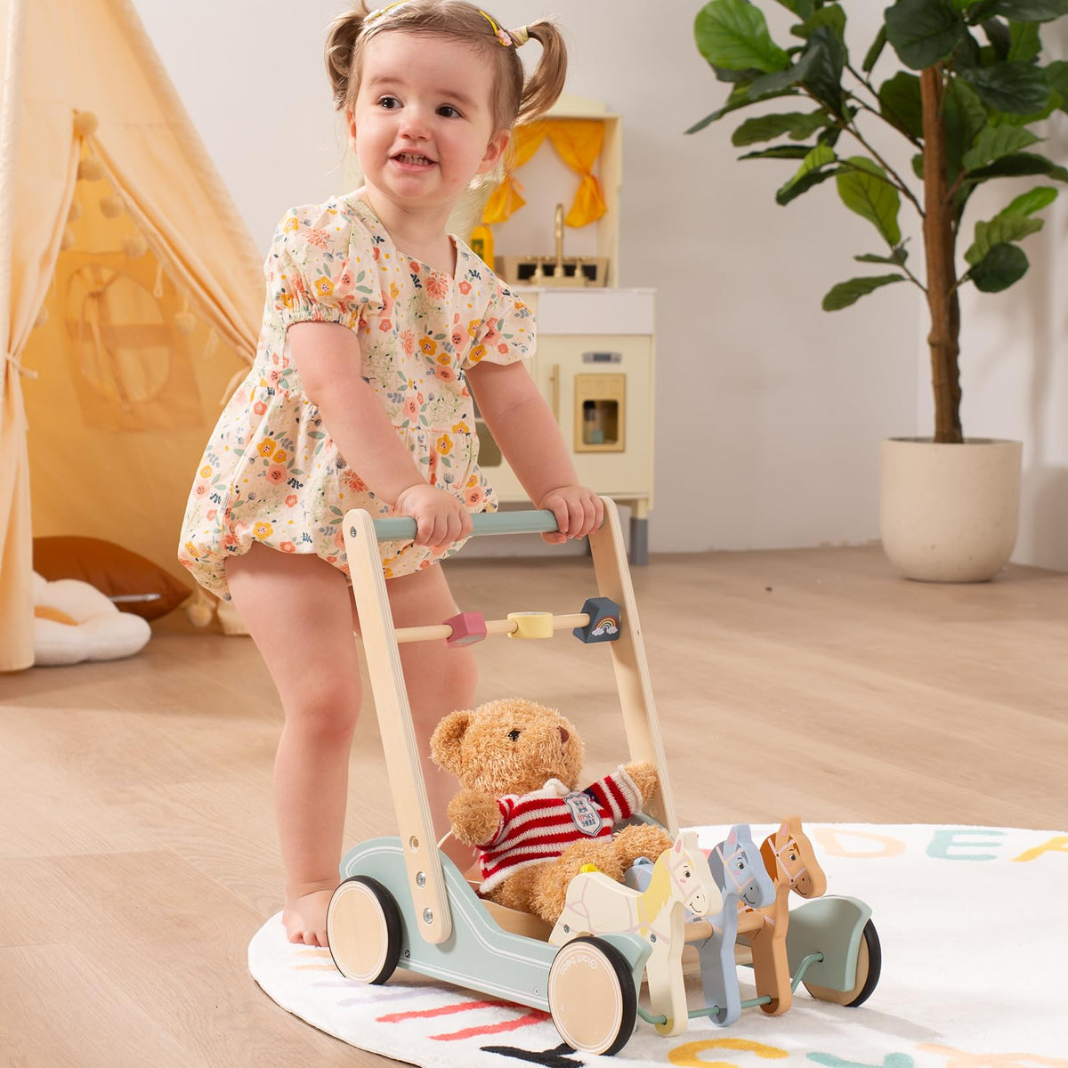Giant Bean wooden baby walker side profile showing rubber wheels
