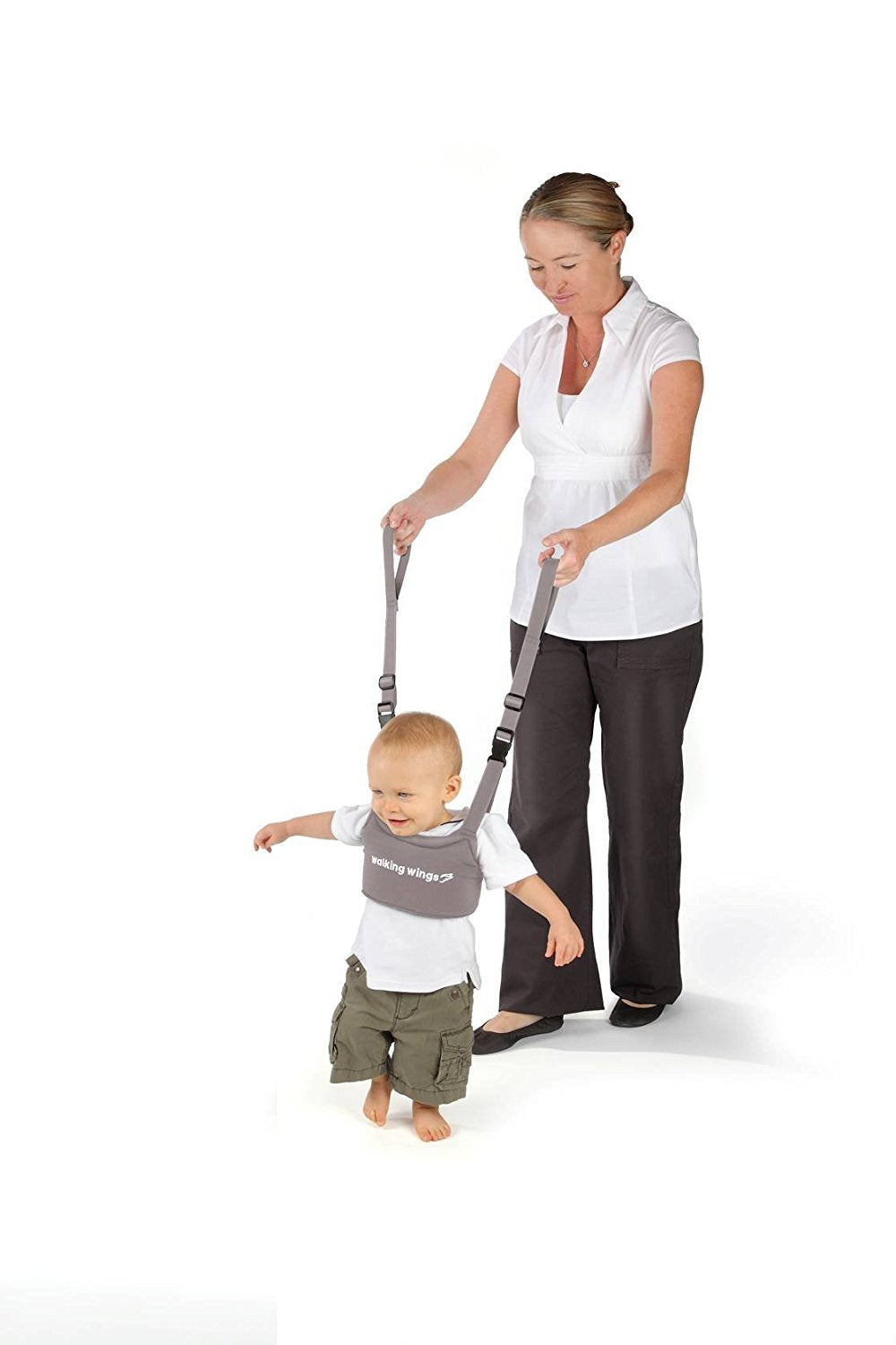 Parent using UpSpring Baby Walking Wings to assist toddler walking