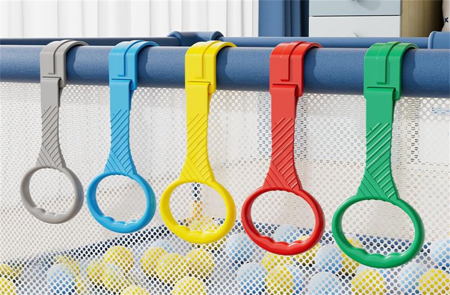 Baby using colorful crib pull rings for standing practice