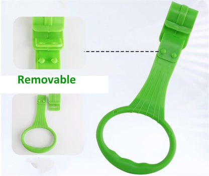 Toddler holding onto crib hanging rings for support