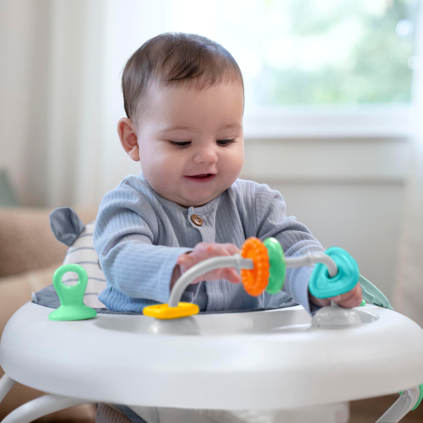 Ingenuity baby walker showing adjustable height settings