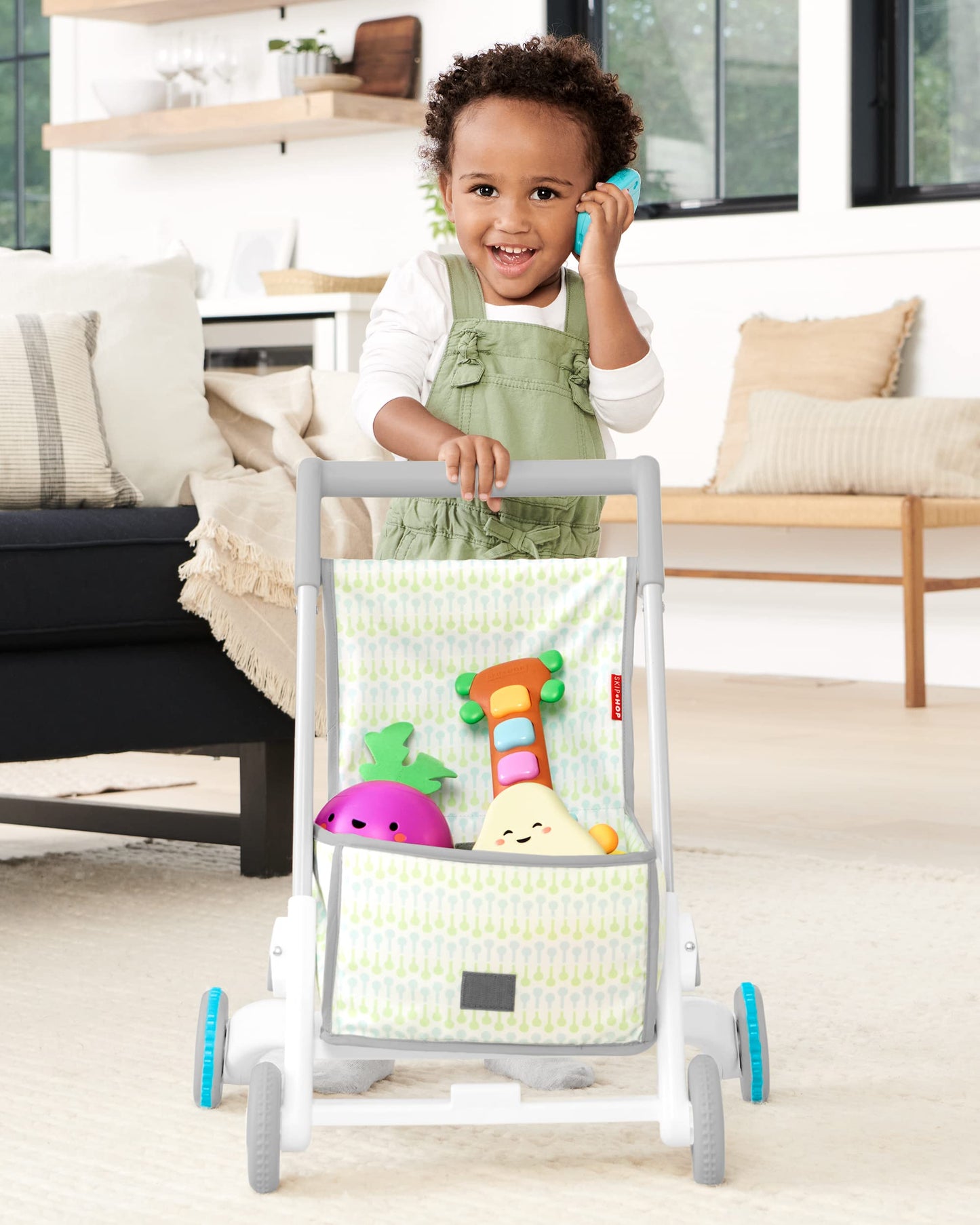 Child using Skip Hop 4-in-1 walker for cruising