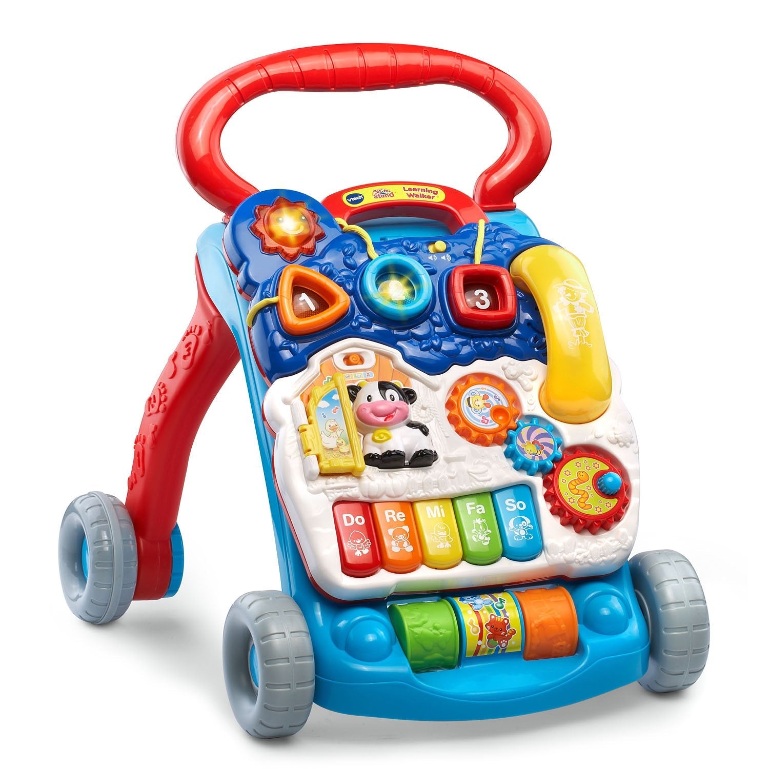 Toddler playing with VTech learning walker piano keys