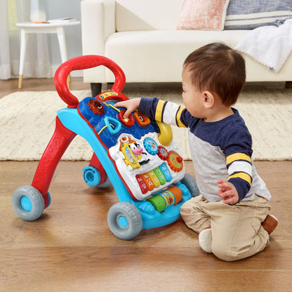 Child using VTech Sit-To-Stand walker for early steps