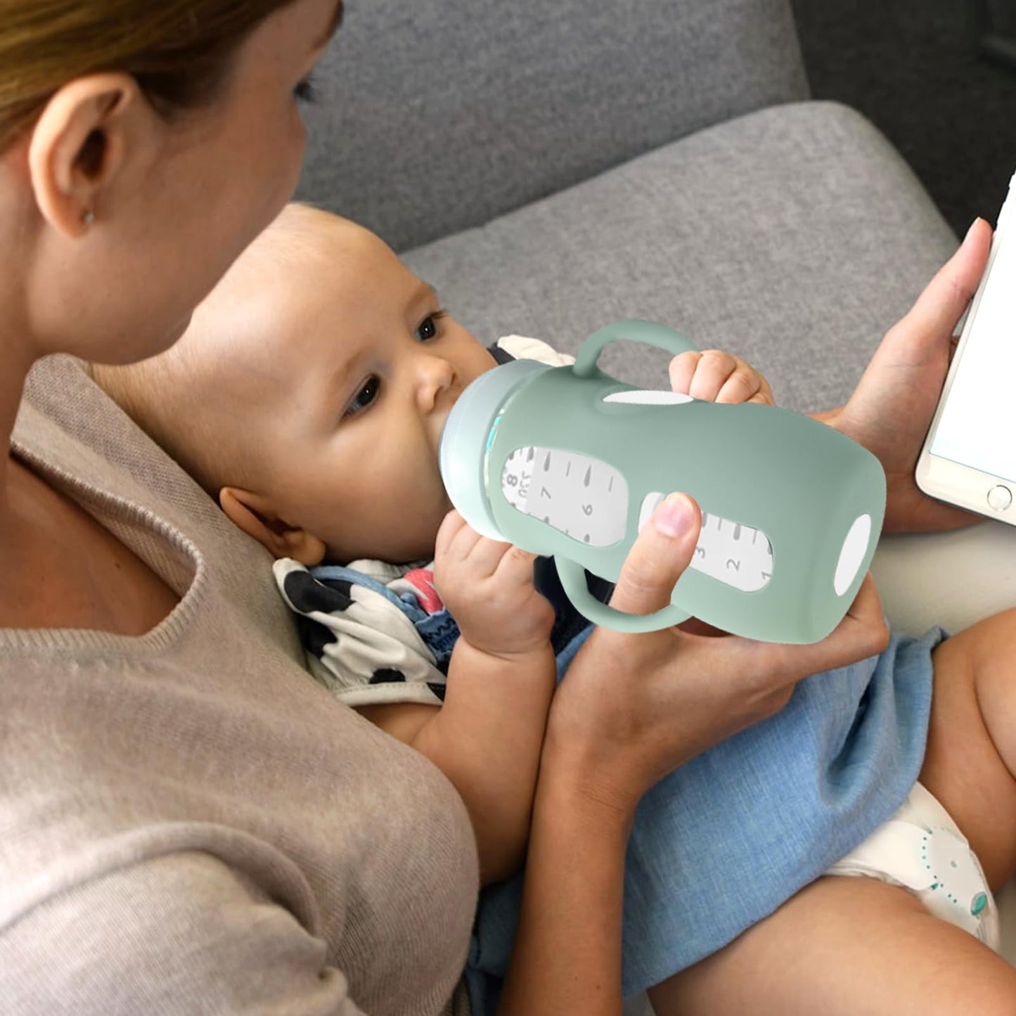 Durable and stretchable Juome silicone protective sleeve being applied to a glass bottle.