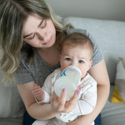 Dr. Brown's baby bottle packaging showing anti-colic features