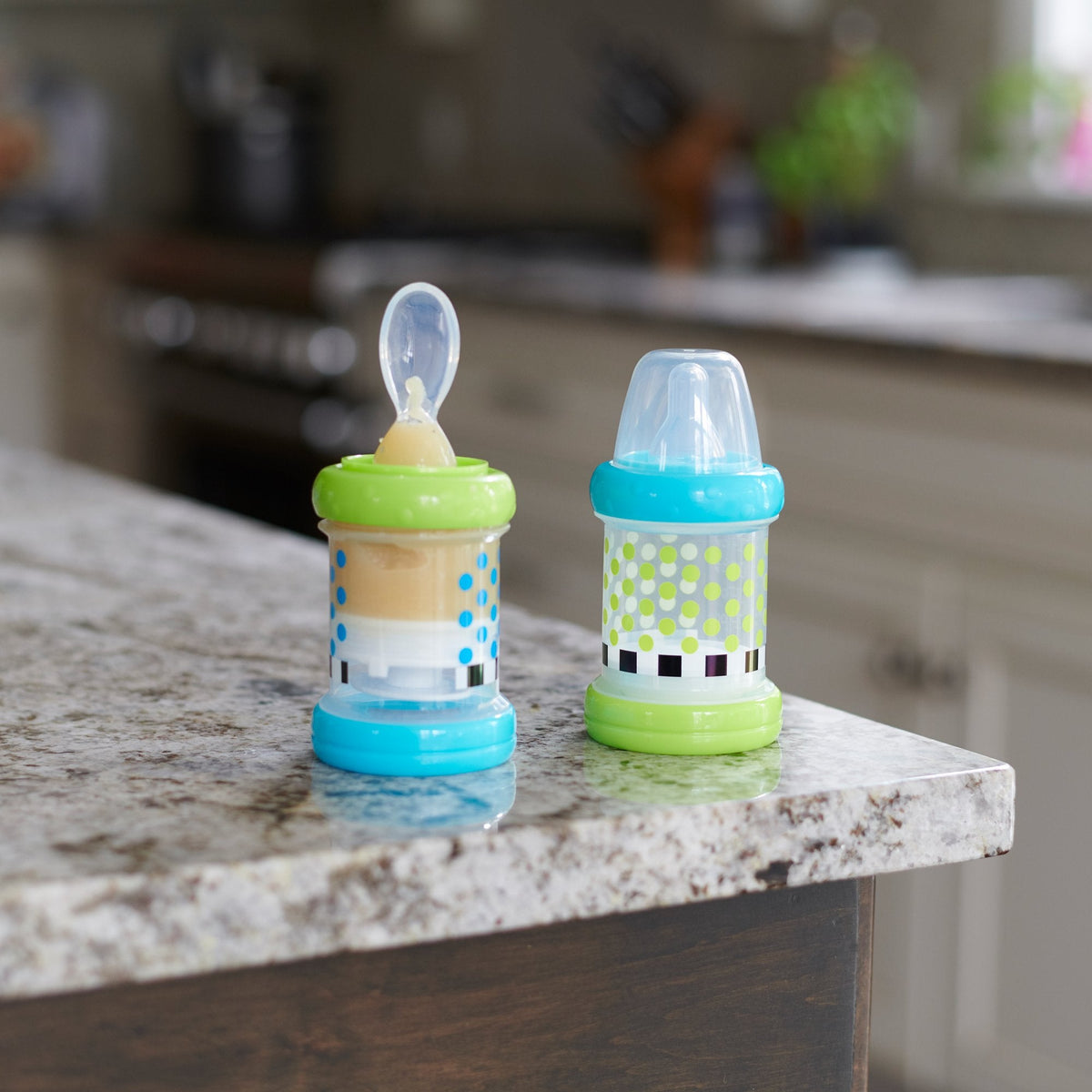 Sassy infant feeder bottle with spoon attachment