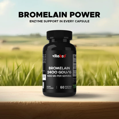 Vitabod Bromelain dietary supplement bottle held in hand
