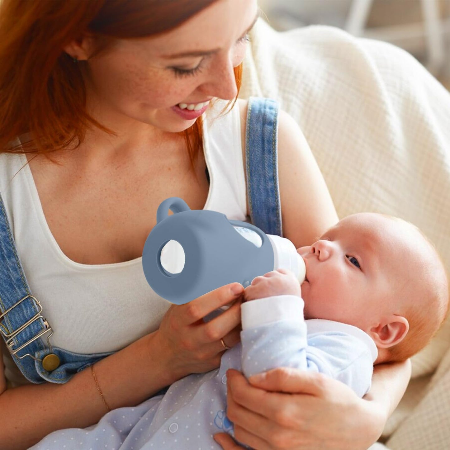 Shockproof silicone sleeve protecting a baby bottle from accidental drops