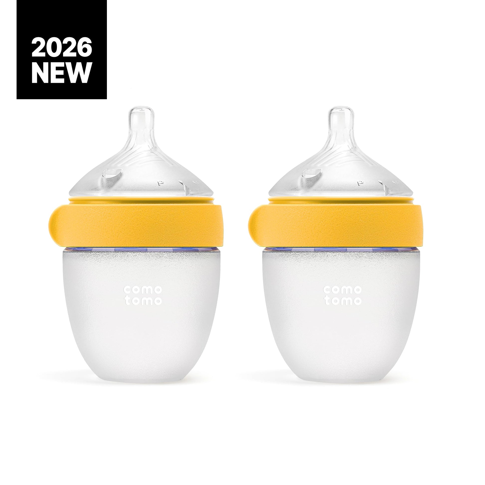 Comotomo five ounce silicone feeding bottles in yellow showcasing the squeezable medical grade material.