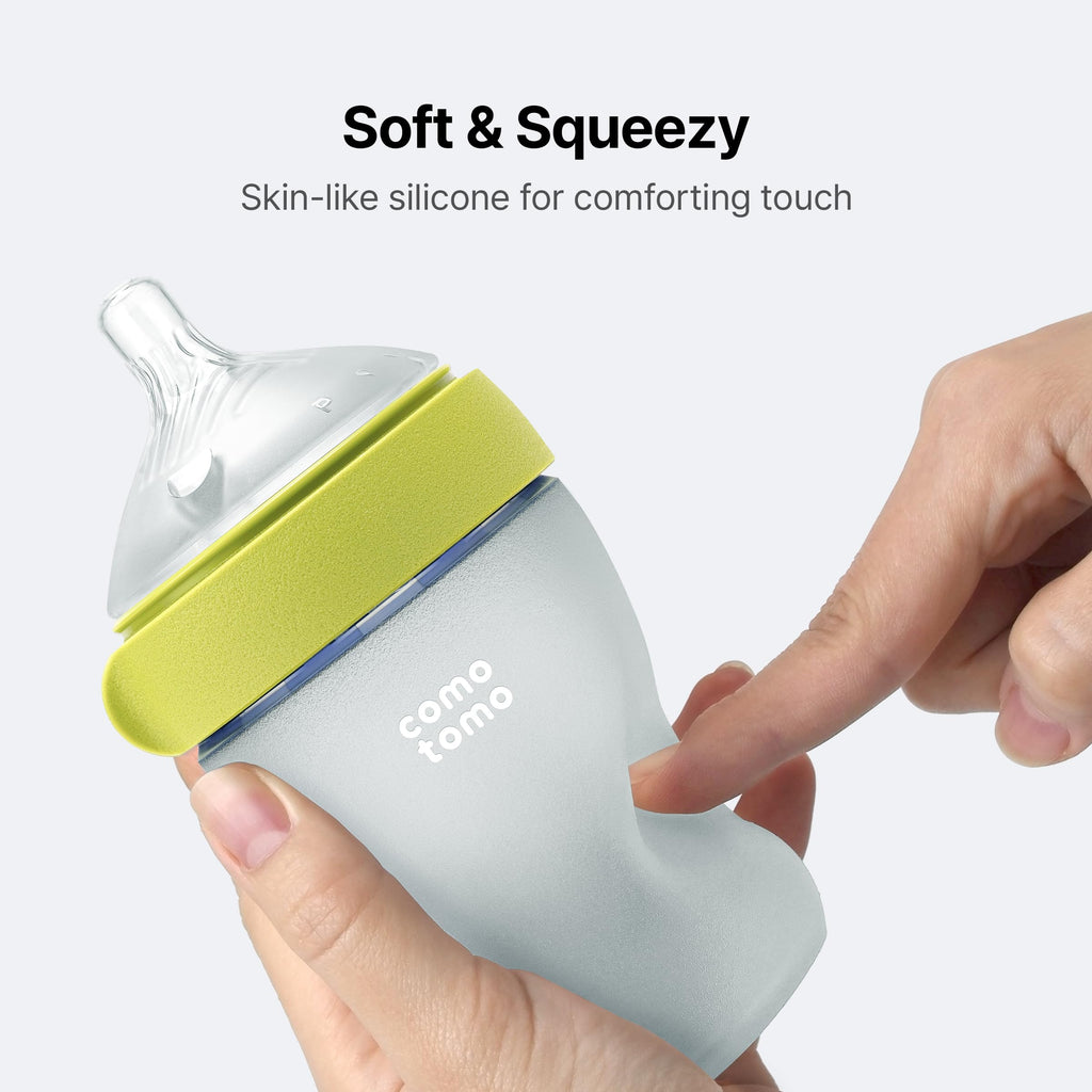 Top down perspective showing the ultra wide neck opening of the green Comotomo bottle for easy cleaning.