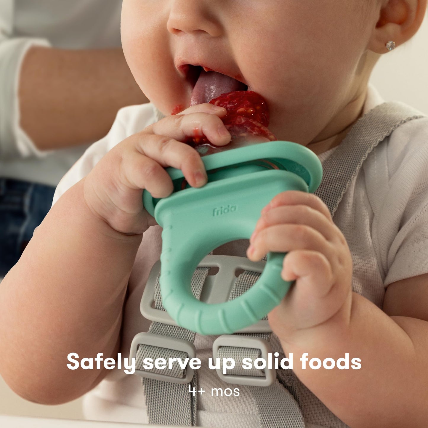 Frida Baby fruit feeder showing the push-pop mechanism functionality