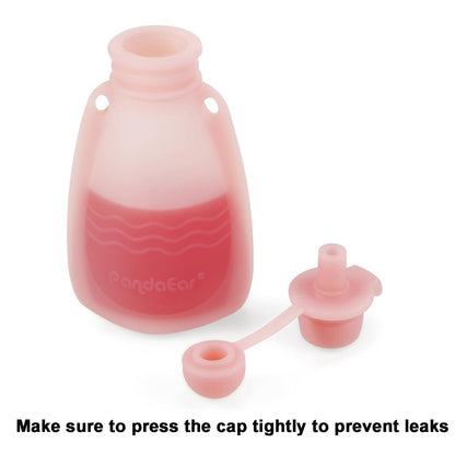 Hand holding PandaEar silicone food pouch with puree