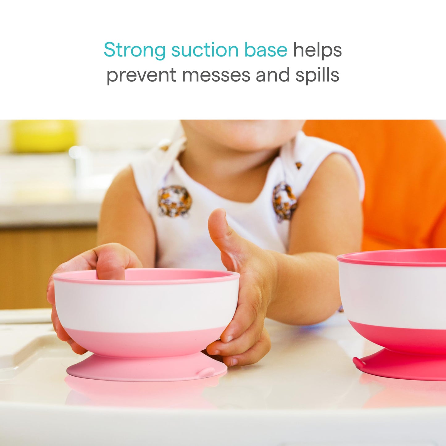 Three Munchkin suction bowls in pink and purple colors