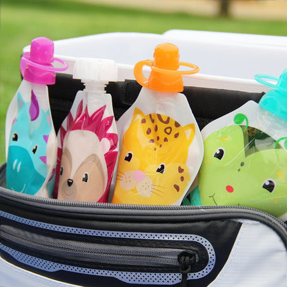 Toddler holding ChooMee squeeze pouch for independent feeding