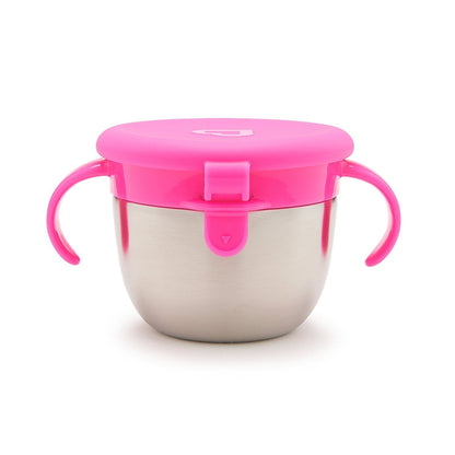 Toddler holding Munchkin snack catcher cup