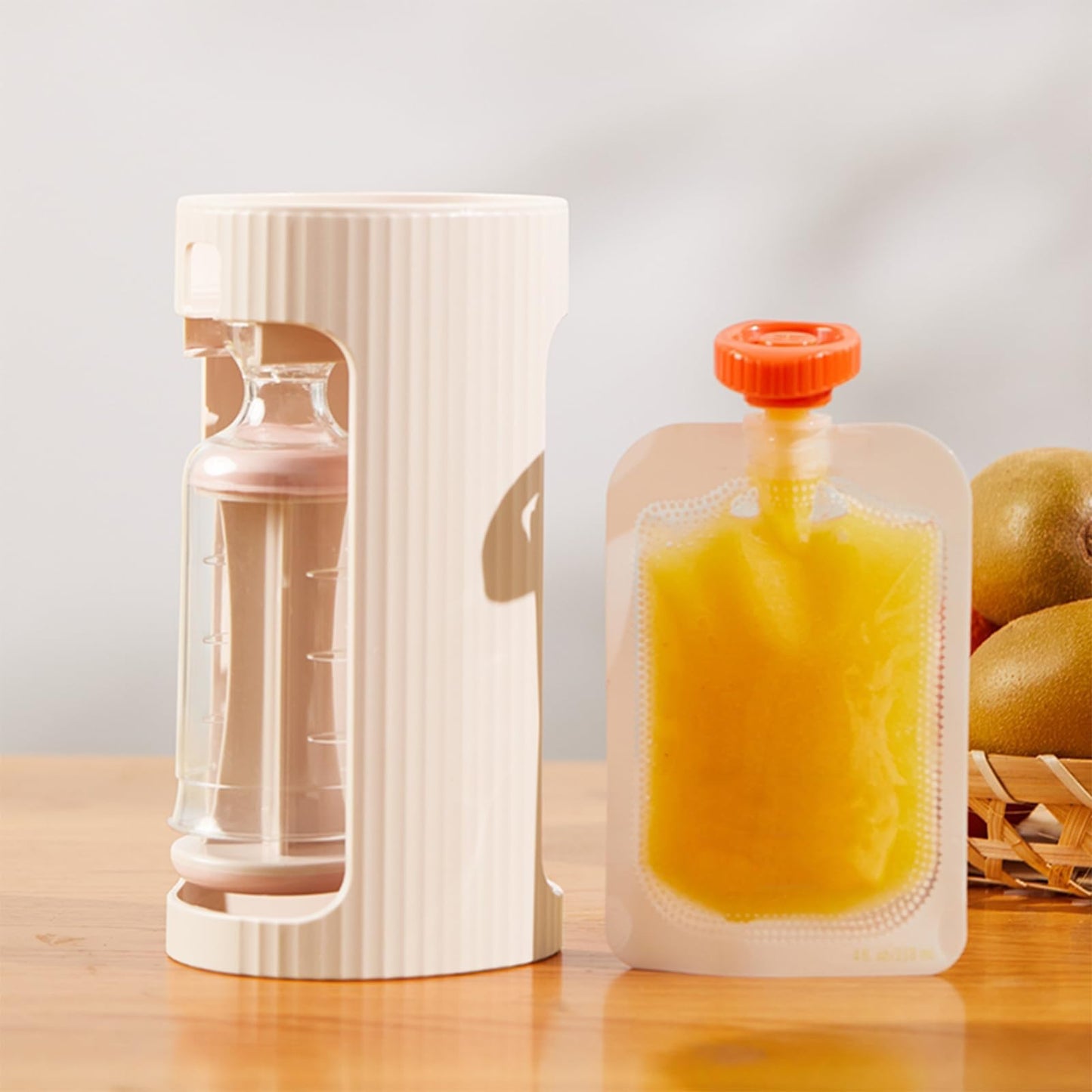 Parent using PandaEar squeeze station to fill baby food pouches