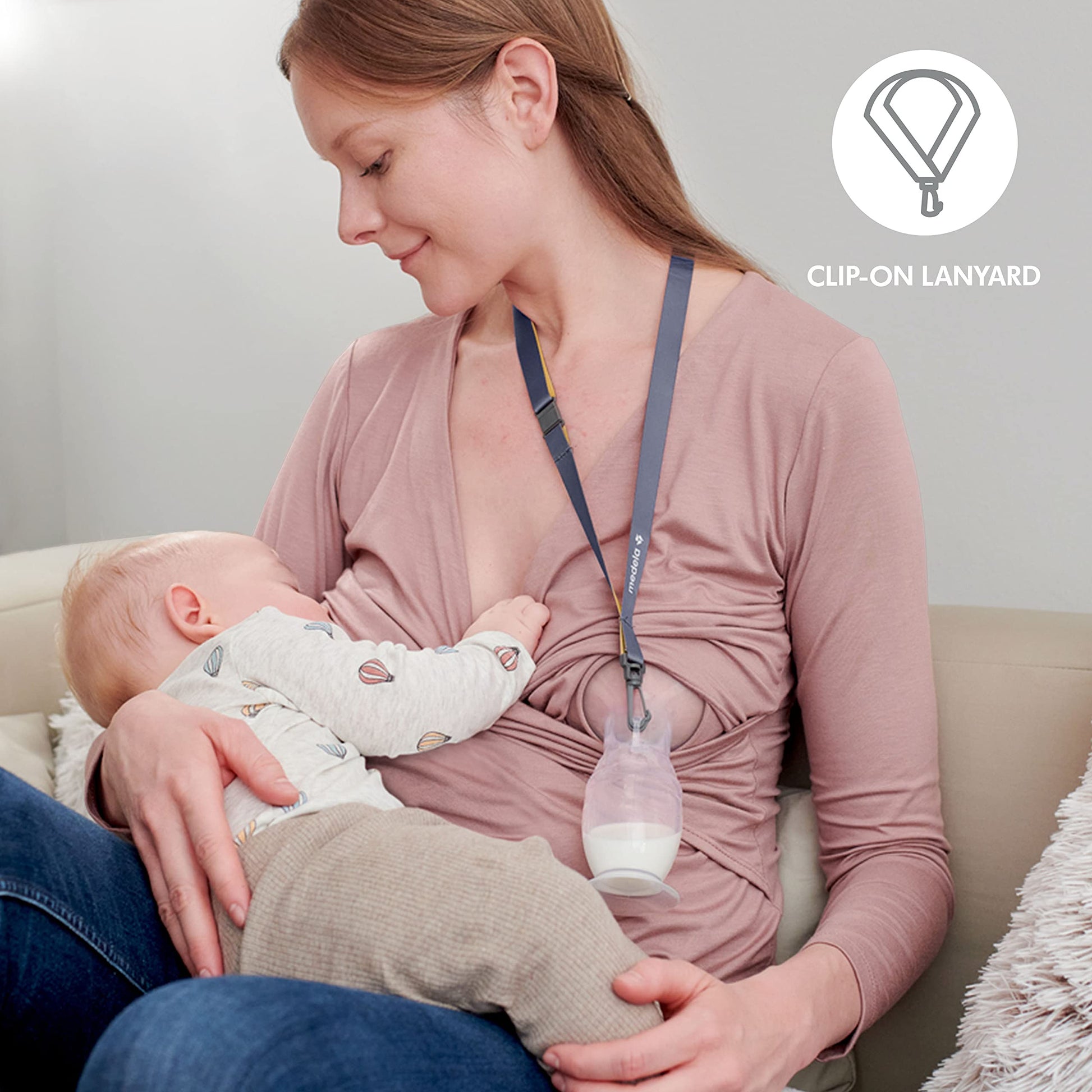Medela milk collector with suction base on a flat surface