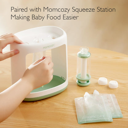 Toddler holding Momcozy reusable food pouch