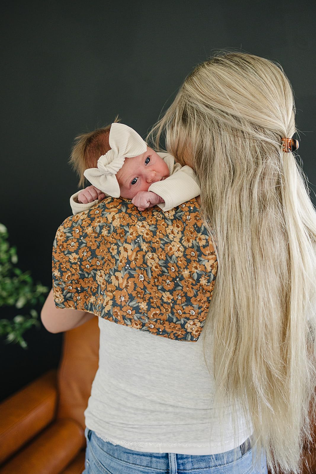 Lifestyle shot of Mebie Baby burp cloth being used