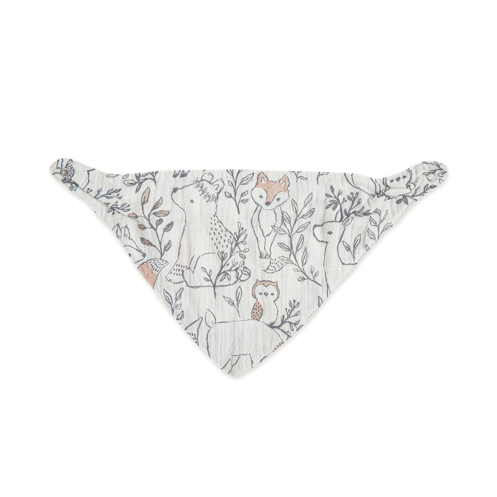 Baby wearing woodland animal print bandana style bib