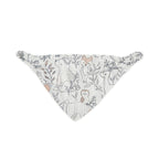 Baby wearing woodland animal print bandana style bib