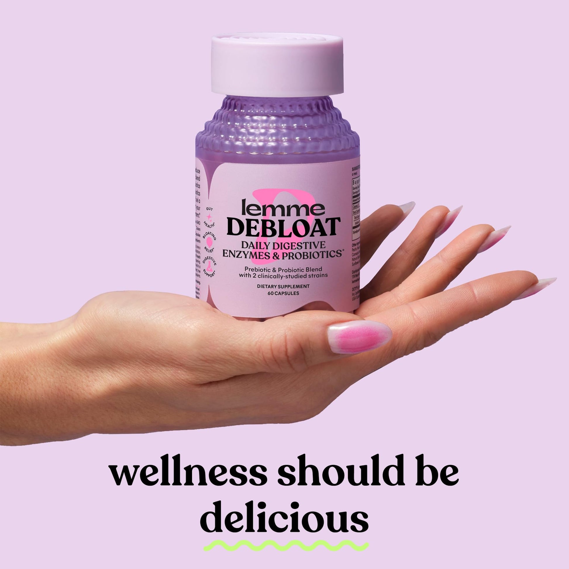Close up view of Lemme Debloat capsules demonstrating the premium plant based formulation.