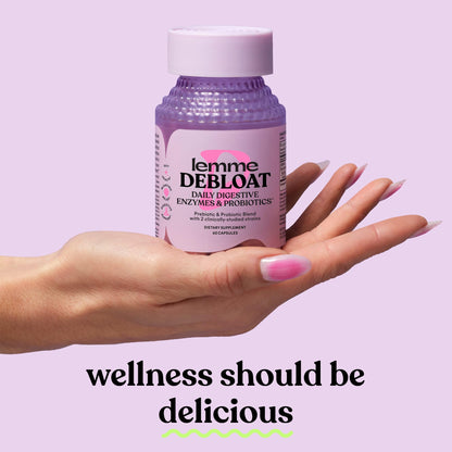 Close up view of Lemme Debloat capsules demonstrating the premium plant based formulation.